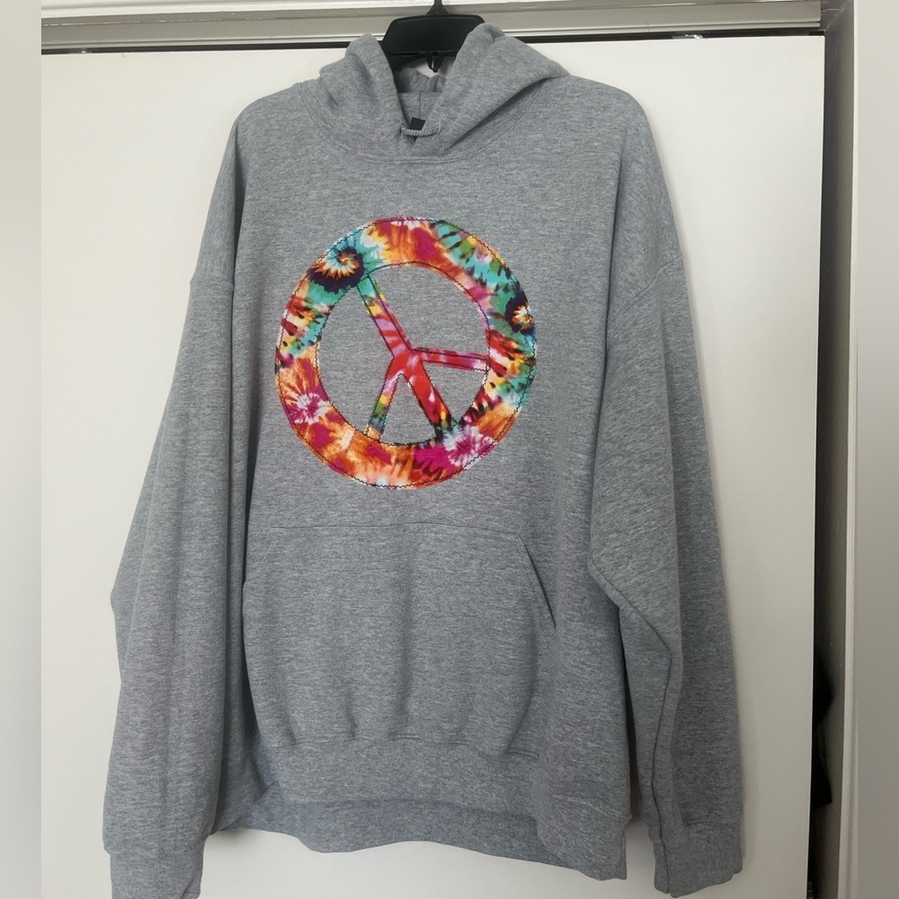Hoodie featuring hand appliquéd ☮️